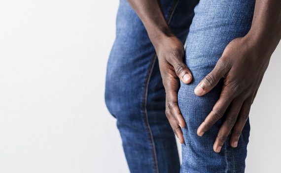 A man showing his leg in pain