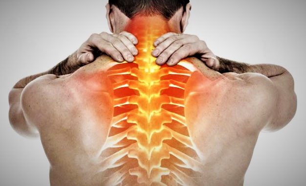 A man holding his neck in pain
